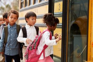 children-getting-on-school-bus